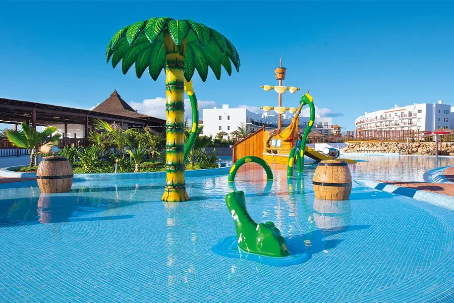 Swimming pool with pirate ship and toys