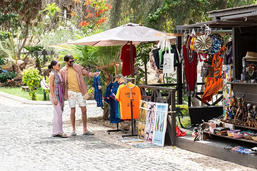 A couple looking at a souvenir stand