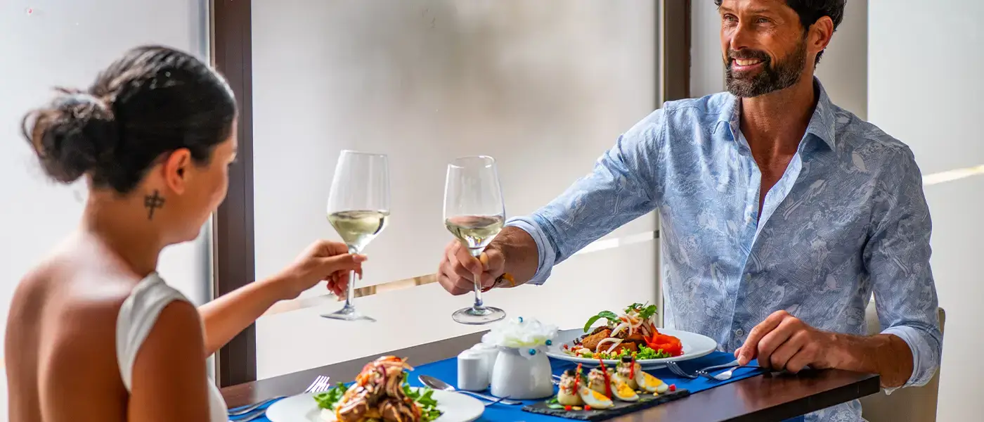 A couple enjoying food and drinks